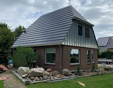Zinken gevelbekleding.